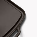 Close-up of a corner and loop handle on the Field long cast iron griddle thumbnail