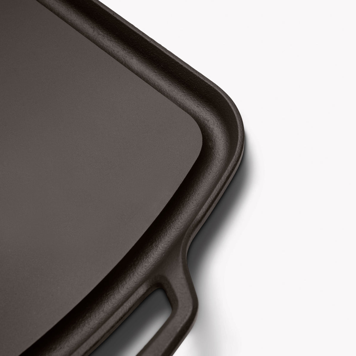 Close-up of a corner and loop handle on the Field long cast iron griddle