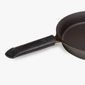 Black Field leather handle cover fitted over a cast iron skillet handle thumbnail