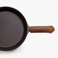 Brown Field leather handle cover fitted on a cast iron skillet handle, seen from above thumbnail