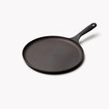 Field round cast iron griddle at an angle, flat surface with a long handle thumbnail