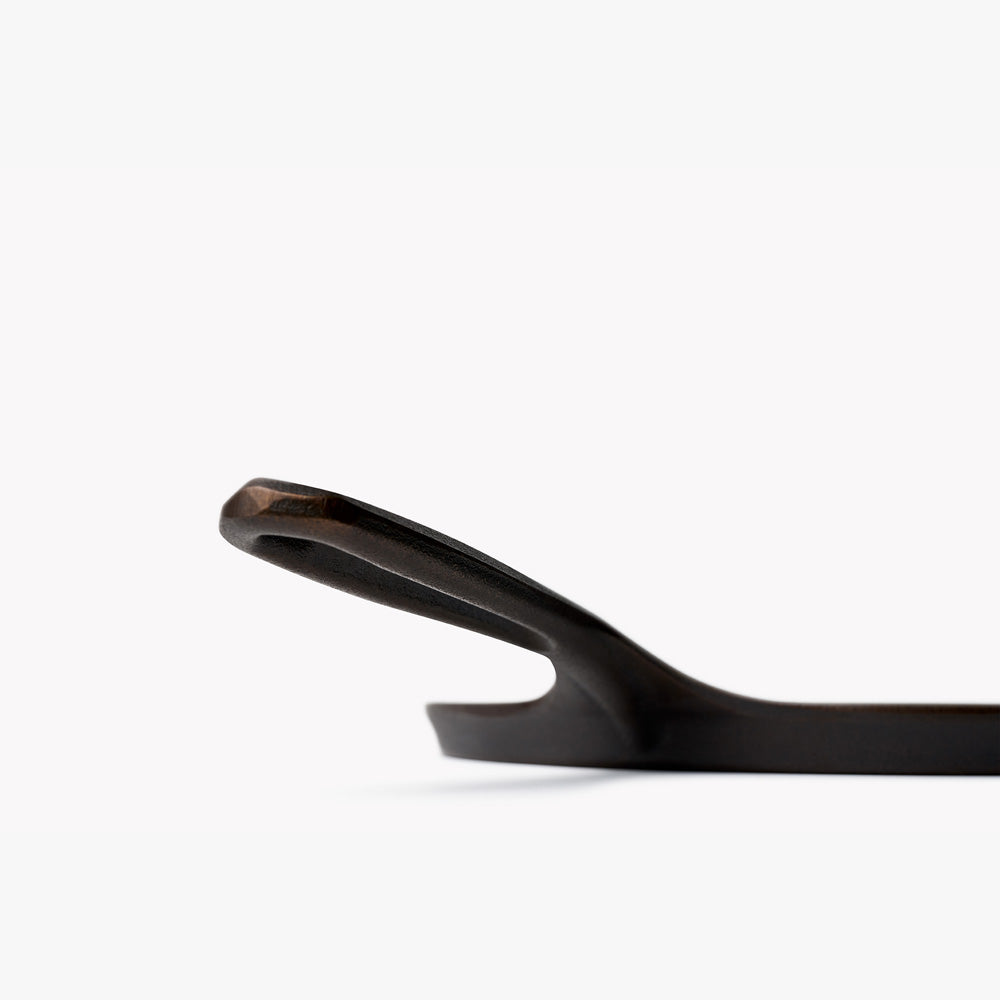 Close-up of the handle where it meets the rim on a Field round cast iron griddle