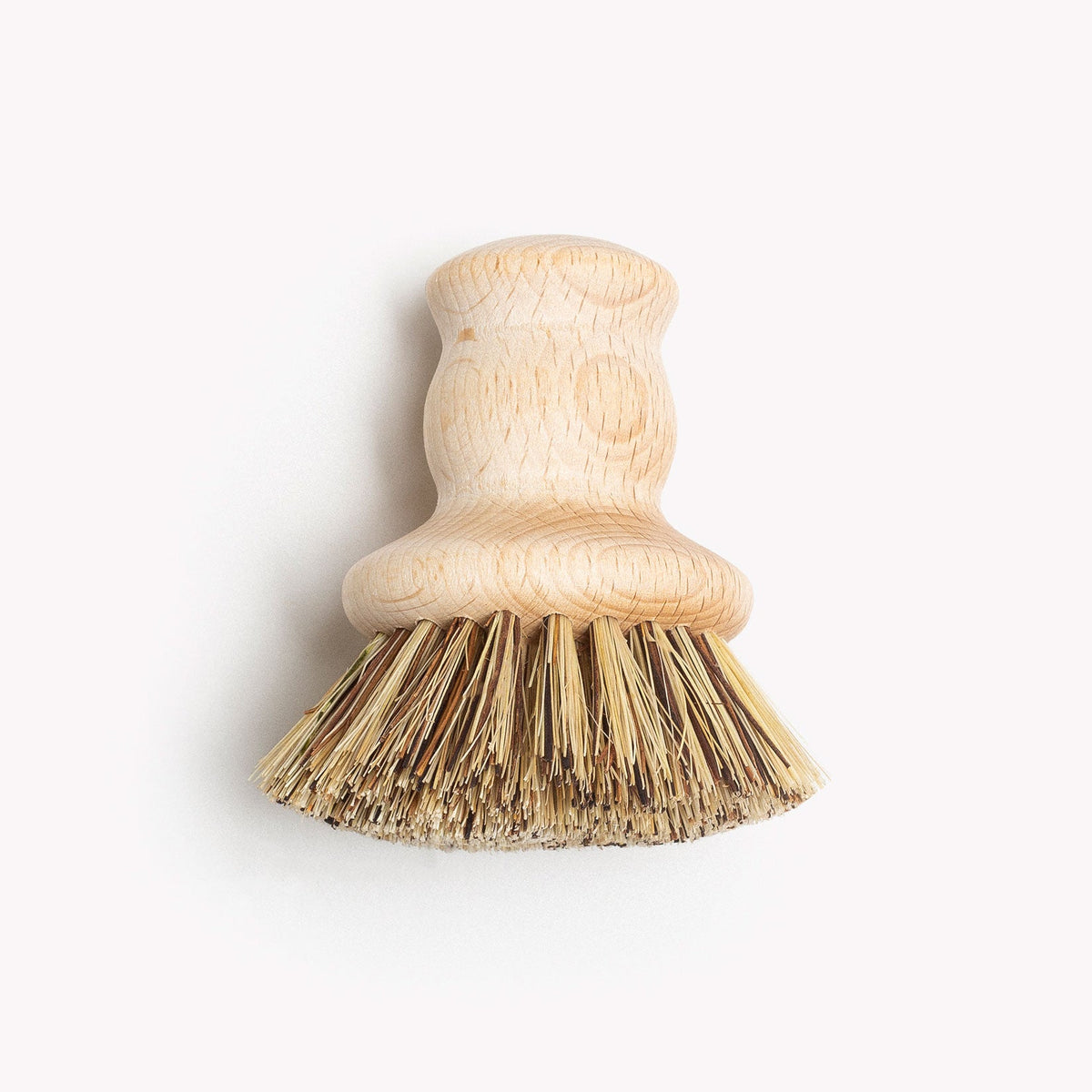 Field natural fiber brush with a turned wood handle and stiff natural bristles