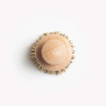 Field natural fiber brush from directly above, wood knob ringed by natural bristles thumbnail
